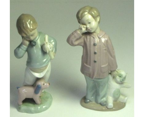 Two Nao figurines; "Sleepy Head, 19cm and "Boy on Phone with Puppets", 18cm, both with original boxes (2). 