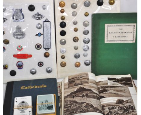 A quantity of railway company buttons and badges, three books relating to the railways and two sets of LNER playing cards.