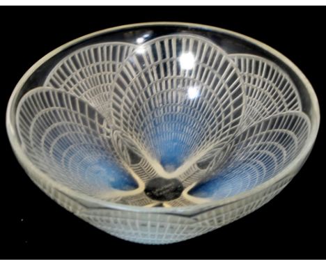 A Rene Lalique glass bowl with scallop design, signed to the base "R Lalique France", diameter 21cm. CONDITION REPORT Miniscu