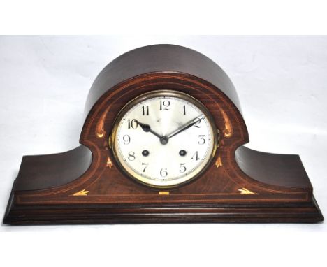 An early 20th century mahogany cased inlaid Napoleon hat chiming mantel clock, the silvered dial set with Arabic numerals, he