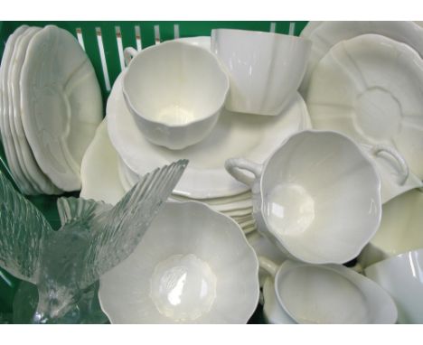 A Royal Crown Derby white part tea service to include cups, saucers and plates also a small pressed glass eagle.