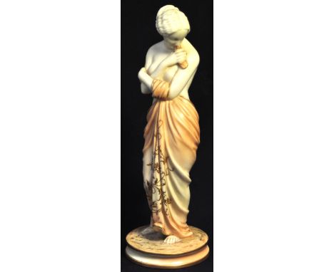 A Royal Worcester figurine of a semi naked female, puce mark to the base no. 2/57, height 26cm. CONDITION REPORT No visible s