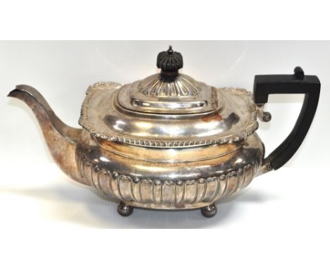 An Edward VII hallmarked silver teapot on bun feet, Sheffield height 24.5ozt, length 32cm.