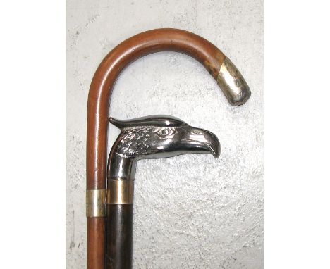 A walking cane with white metal mount inscribed "Presented to Mr T. Smallwood by the Officials and Workmen of the C&W Dept. L