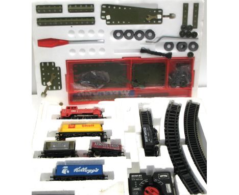 A Meccano Combat Constructions set with original box, cellophane and instruction manual, also a complete Hornby railways elec