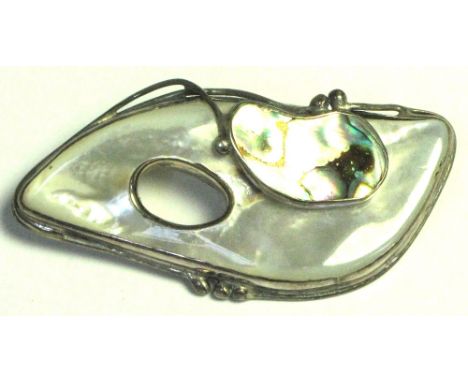 A silver Art Nouveau style brooch set with mother of pearl and abalone shell, length 7cm.