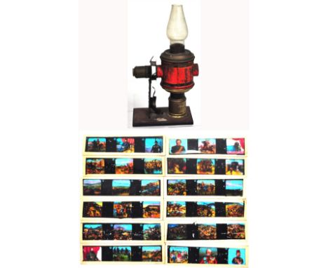 A late 19th early 20th century magic lantern of small proportions with a quantity of slides depicting the Boer War.
