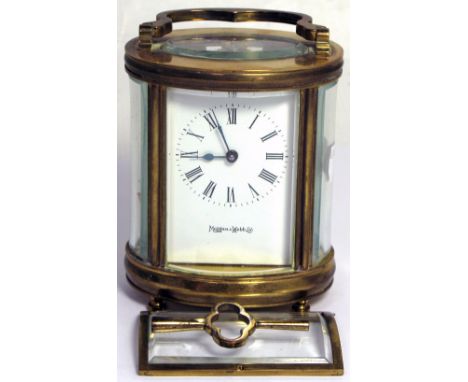 A Mappin and Webb oval eight day brass carriage clock, the enamel dial set with Roman numerals (af).