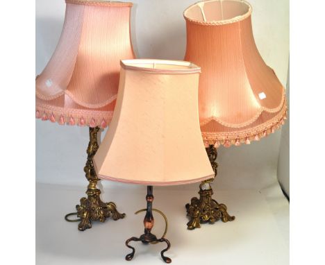 A pair of brass table lamps with pink silk shades and one other metal table lamp (3).