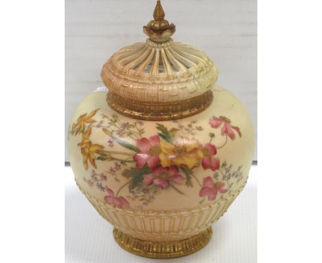 A Royal Worcester blush Ivory baluster vase with cover and additional crown shaped cover, hand painted with daffodils, daisie