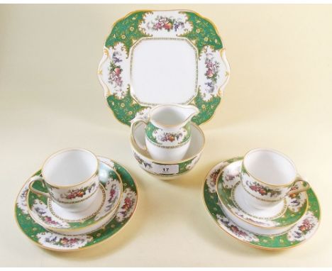 A Brantwood green and floral tea service comprising seven cups and six saucers, five tea plates, cake plate, jug and sugar