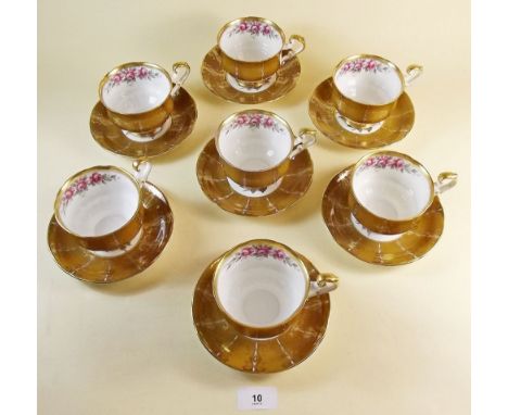 A Paragon floral tea service comprising seven cups and saucers