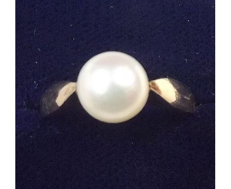 A 14 ct gold pearl ring on sloping shoulders, size O 1/2