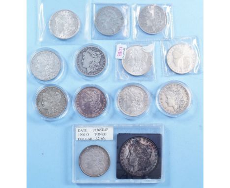 A group of twelve USA Morgan dollars - 0.900 silver with dates: 1886, 1894 o, 1897 o, 1900 o and 1910 s, 1902, 1921 and 1921 