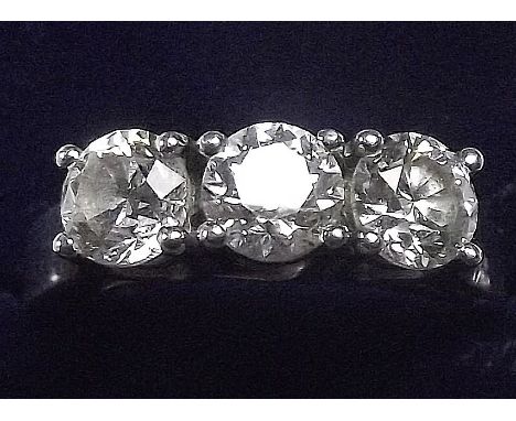 A good three stone diamond ring set in platinum, the three stones .70 carat, .72 carat and .70 carat - all matched to colour 