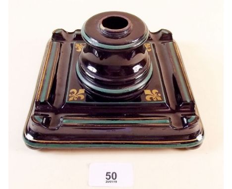 A French ceramic and metal black and gilt inkwell