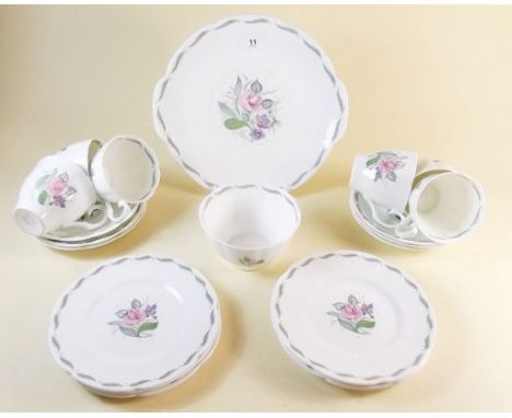 A Susie Cooper tea service comprising six cups and saucers, cake plate, six tea plates, and sugar - pattern C440