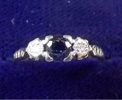 An 18 carat gold and platinum ring set diamond and sapphires ring size L