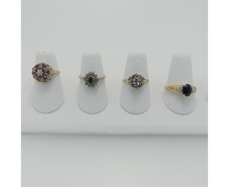 A ruby and diamond cluster Ring, mounted in 9ct yellow gold, Size J½, together with two sapphire and diamond cluster rings, o