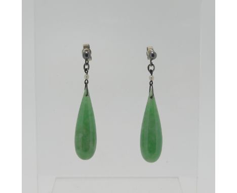 A pair of vintage jade drop Earrings, with seed pearl surmount and stud fittings, the jades 2.5cm long. 