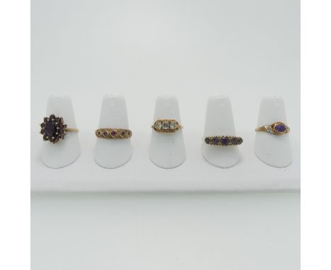 A 9ct gold garnet cluster Ring, Size O, together with a small ruby five stone ring, Size P½, a small amethyst and diamond rin