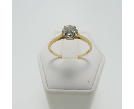 A diamond solitaire Ring, the circular stone approx 0.5ct, claw set in 18ct yellow and white gold on a narrow plain band, Siz