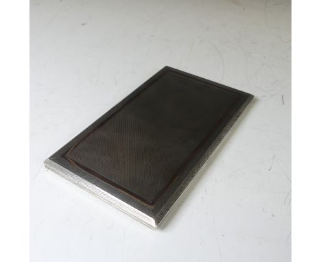 A George VI silver Cigarette Case, by W H Manton Ltd., hallmarked Birmingham, 1951, of rectangular form with slide action hin