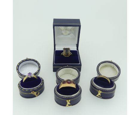 Four 9ct gold Rings; one set smokey quartz, Size N, one in an antique style set three red pastes, Size R, one small amethyst 