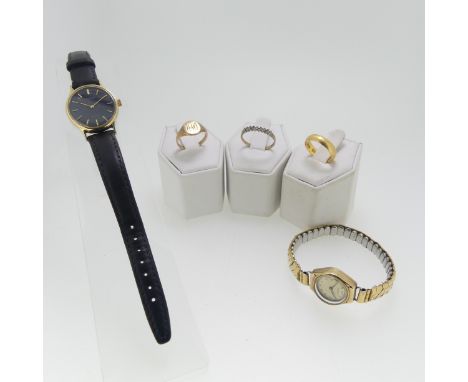 A 22ct yellow gold Band, Size L, 3.5g, together with two s all 9ct gold rings, one set blue and white pastes, as found,&nbsp;