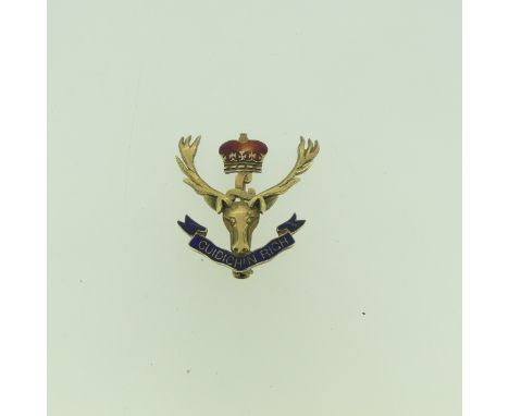 A 9ct gold and enamel Regimental Crest Brooch, for the Seaforth Highlanders (Canada), 3.2cm long, 5.1g,&nbsp;chip to red enam