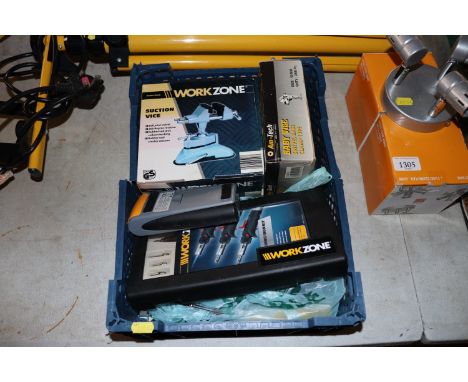 A box of tools to include vices