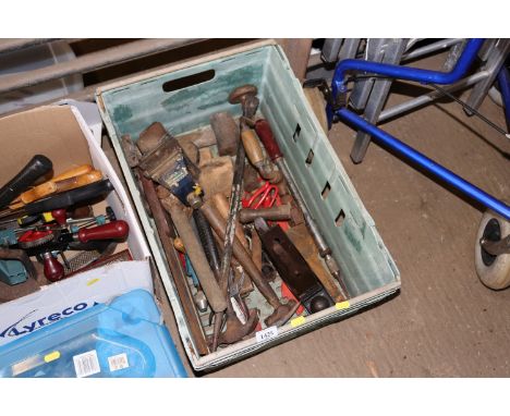 A plastic crate of various tools to include planes, bench vice etc