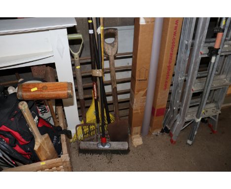 A quantity of long handled garden tools to include spade and fork