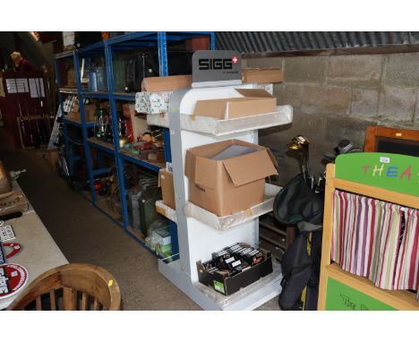 A display shelf unit on wheels with adjustable shelves