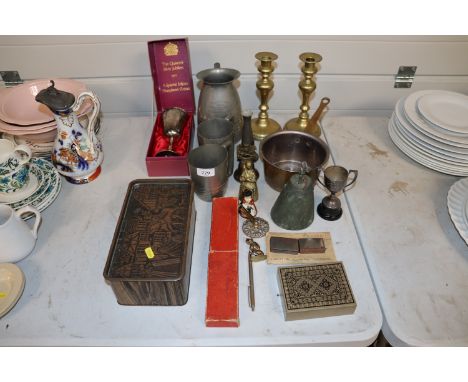 A pair of brass candlesticks, a brass skillet, various plated ware, advertising tin etc