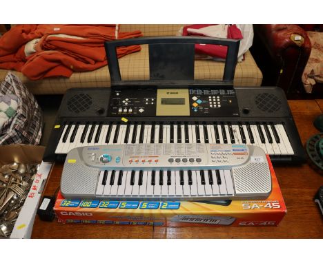 A Casio keyboard and a Yamaha keyboard