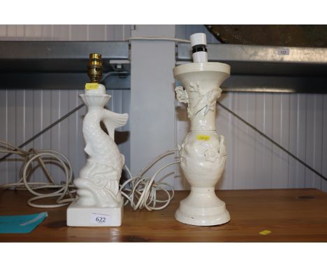 A Casa Pupo white glazed pottery table lamp in the form of a dolphin and an iron white painted Oriental table lamp