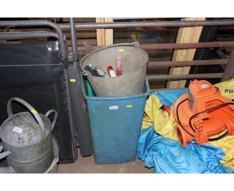 A plastic bin together with a galvanized pail and contents of gardening tools