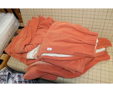 Three pairs of orange curtains