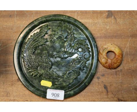A green jade coloured hardstone dragon decorated plate and an orange hardstone archers ring&nbsp;