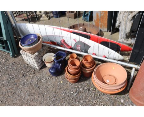 A quantity of various terracotta planters; blue glazed planter in the form of a vintage shoe etc. 