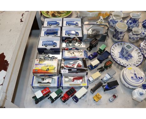 A collection of various boxed and unboxed model vehicles