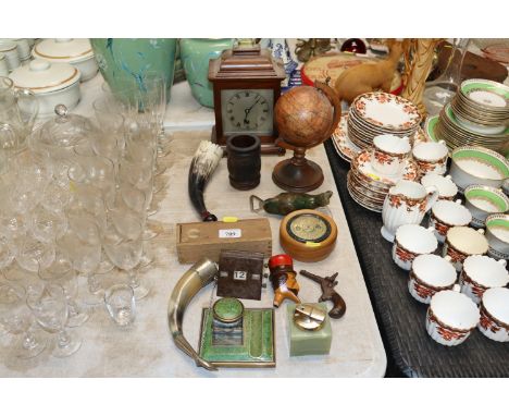 A small table globe, a mantle clock, various wooden ware, horn flasks, a Bakolite desk calendar, ink well etc