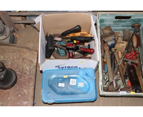 A box and a plastic crate of various tools