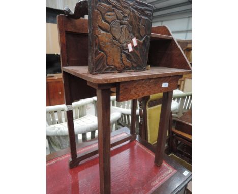 An early 20th century oak hall table in the Art Deco style having drawer and shelf and an early 20th century stained frame Ea