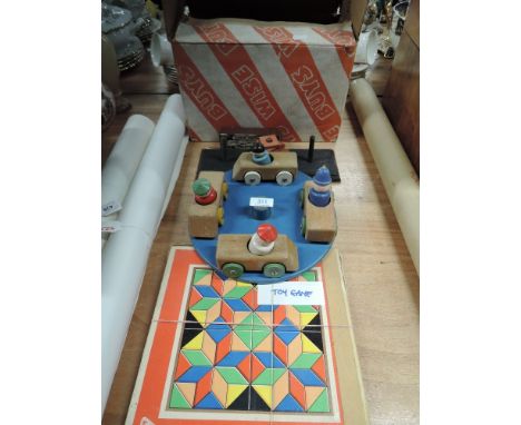 A selection of vintage toys and games including wooden roundabout