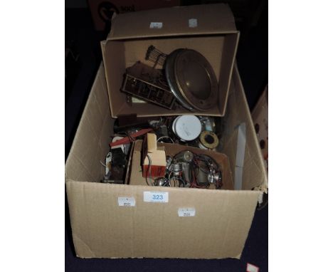 A box of clock and electrical spares etc