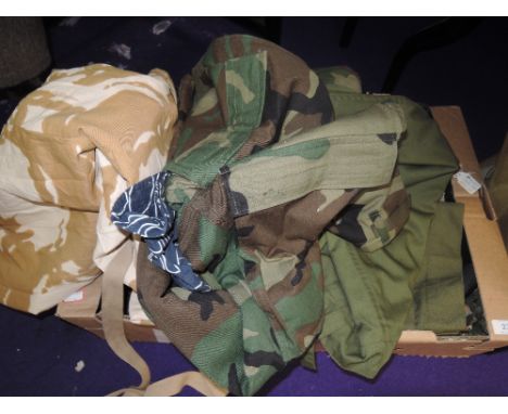 An interesting lot containing a variety of army/camouflage trousers and similar, a couple of bags,a jacket new with tags a su