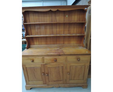 A vintage pine kitchen dresser