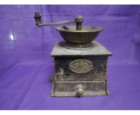 A cast iron coffee grinder by Kenrick